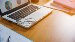 Person at a laptop performing keyword research for local SEO strategy
