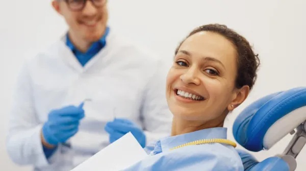 Dentist with patient in modern dental clinic representing local SEO for dental practices
